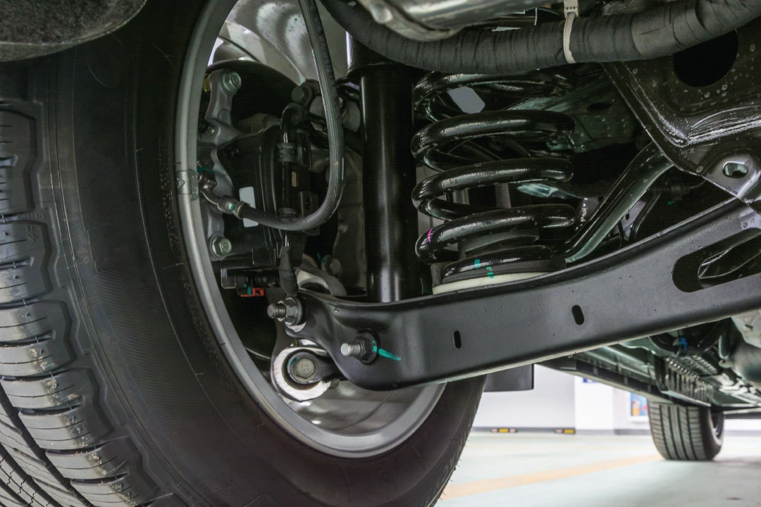 truck suspension being inspected